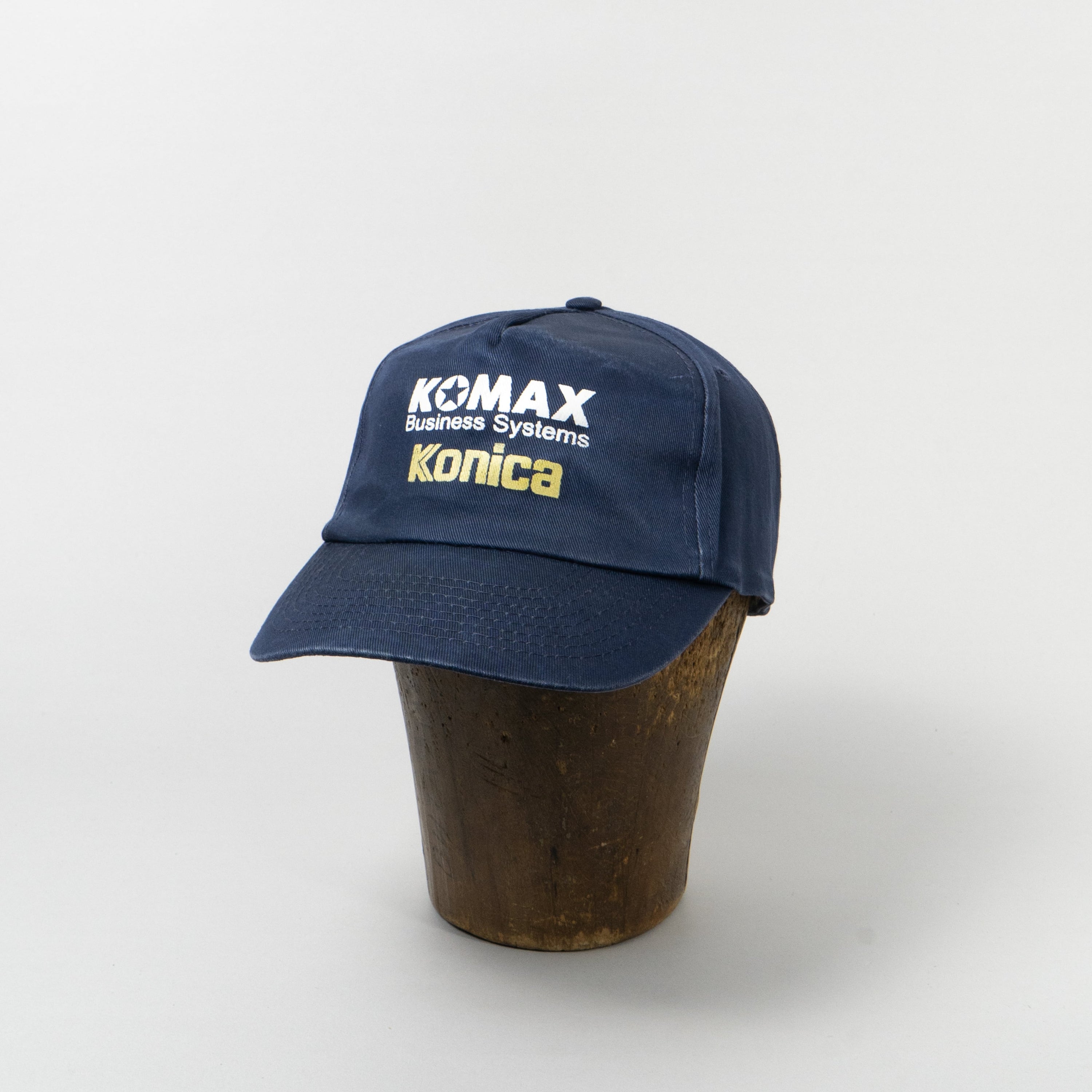 Komax Konica