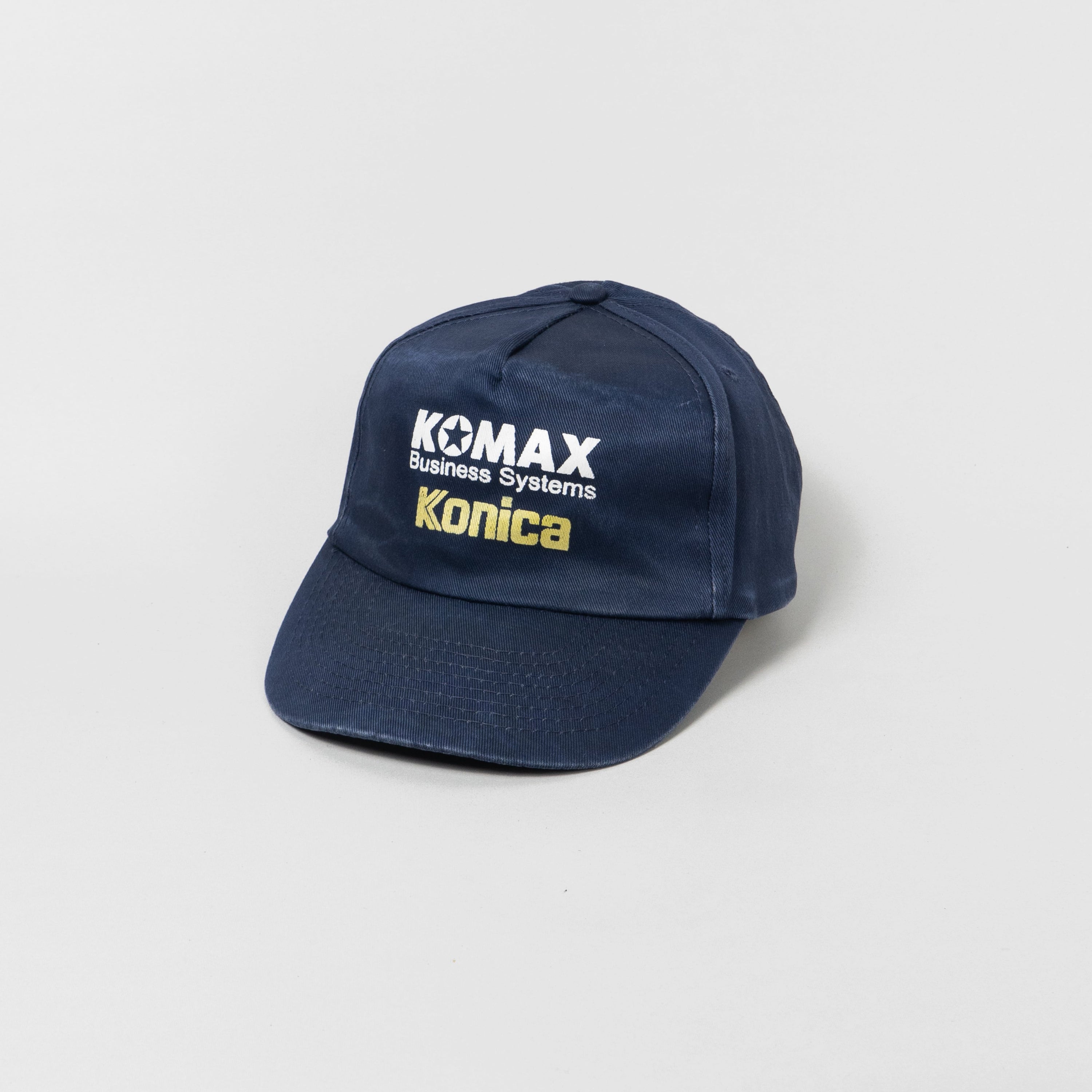 Komax Konica